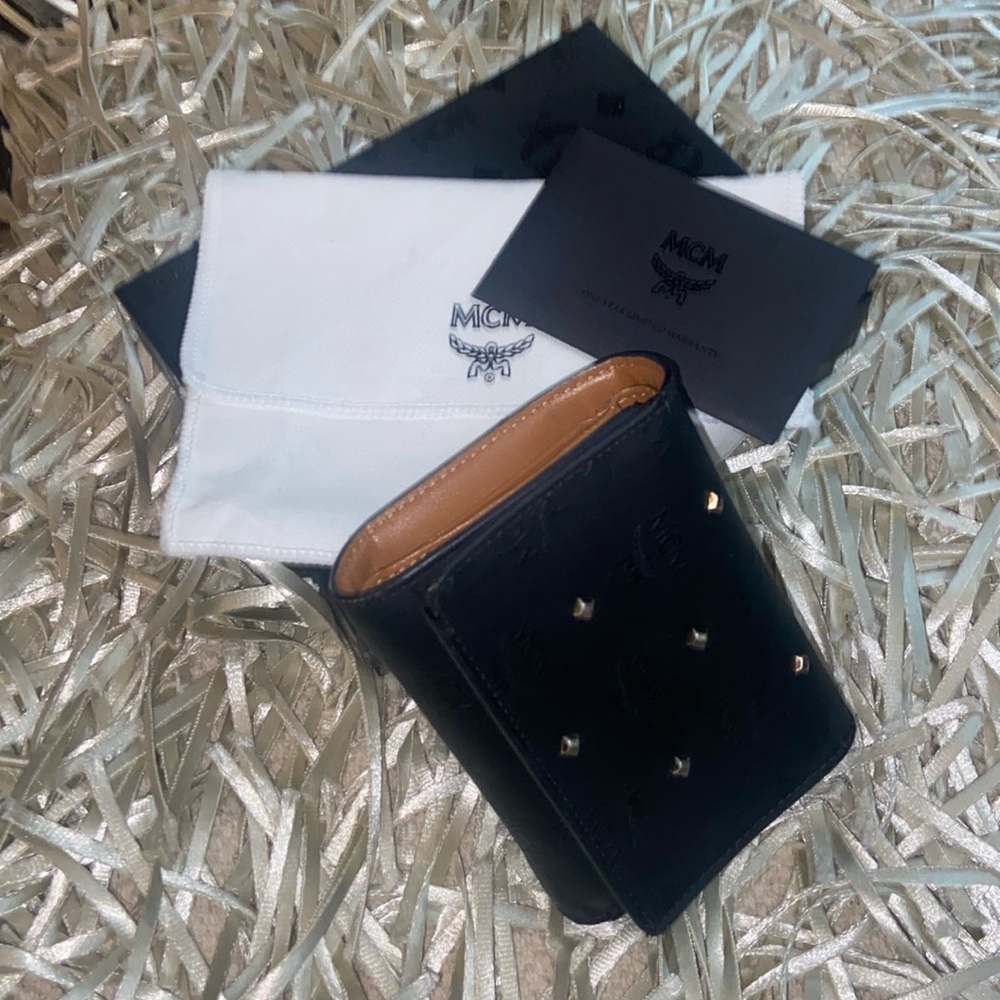 MCM Claudia Trifold Studded Wallet; Excellent condition. Box, authen. card & bag